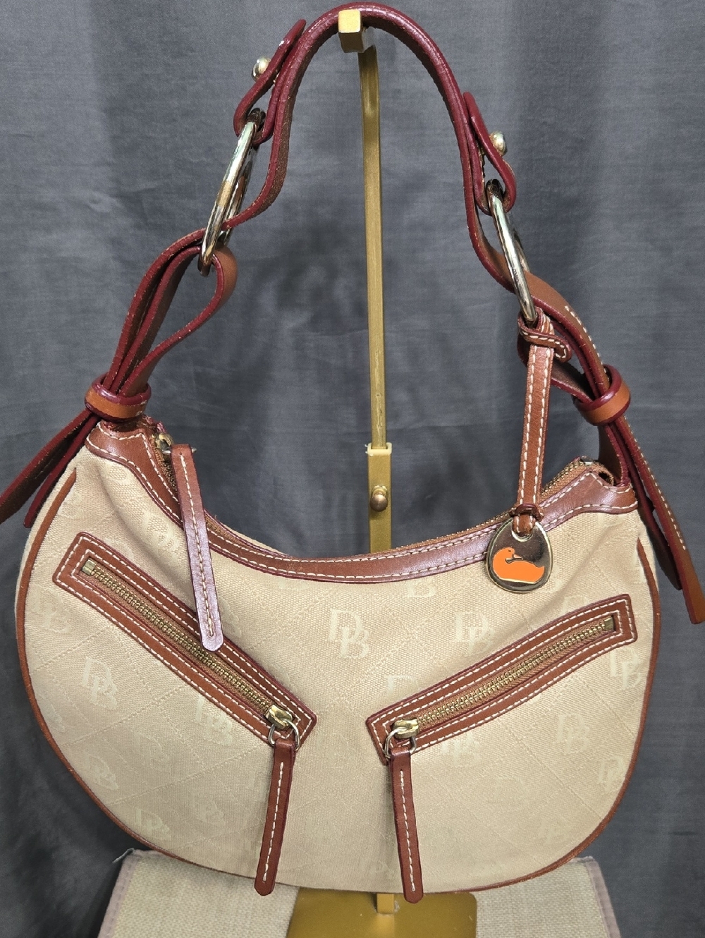 EUC Dooney & Bourke Beige and Brown Crescent Hobo with Orange Logo Charm